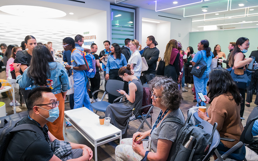 A well-lit indoor space filled with a diverse group of UCSF learners and staff in conversation during the Fall Open House event organized by the UCSF Resource Centers at Parnassus.